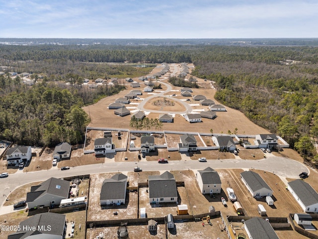 bird's eye view with a residential view and a forest view