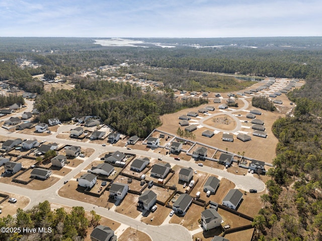 aerial view with a residential view and a forest view