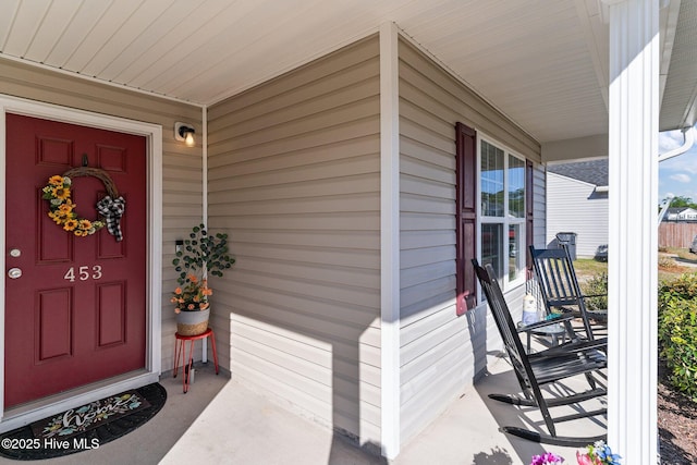 doorway to property with covered porch