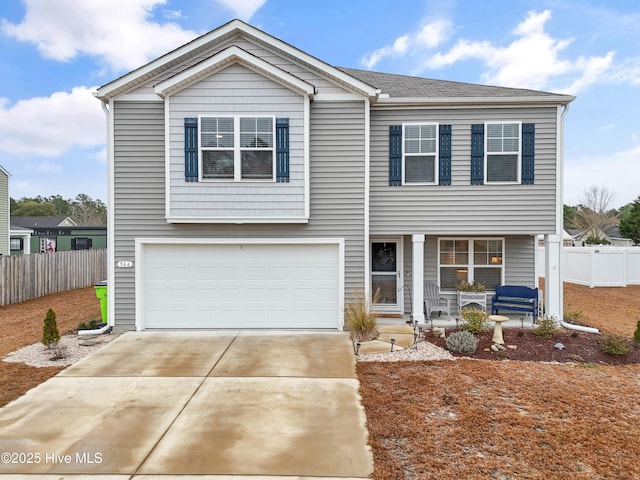 view of front of property with a garage and covered porch