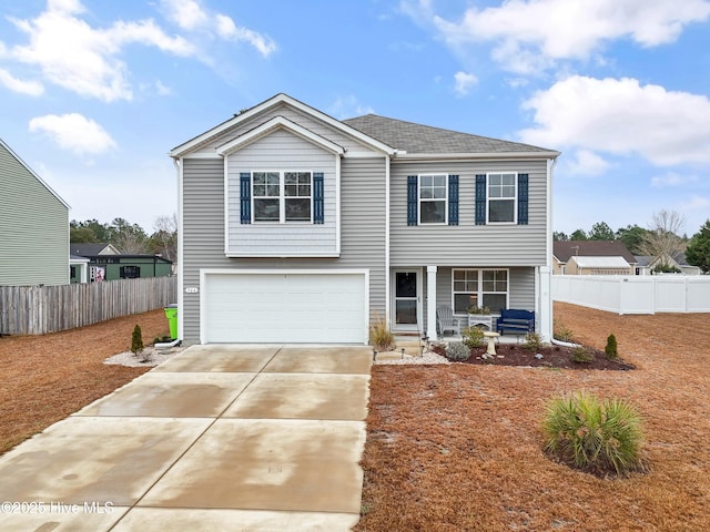 view of front of house featuring a garage and covered porch