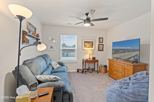 living room with light colored carpet and ceiling fan