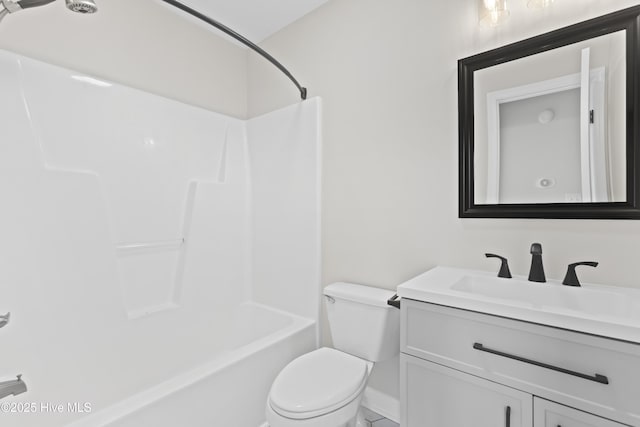 full bathroom with toilet, washtub / shower combination, and vanity