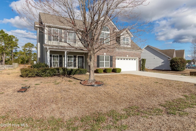 view of front of property with driveway, a garage, fence, and brick siding