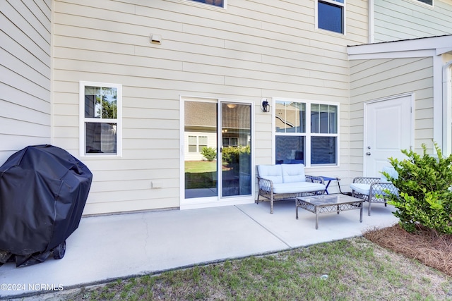 view of patio with grilling area and an outdoor living space