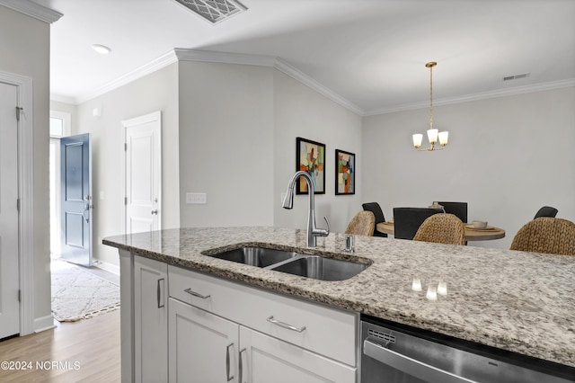 kitchen with white cabinetry, sink, stainless steel dishwasher, light stone counters, and light wood-type flooring