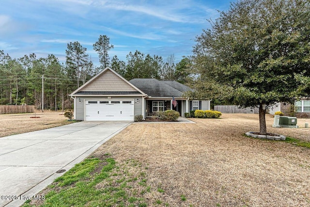 ranch-style house with a garage and a front yard