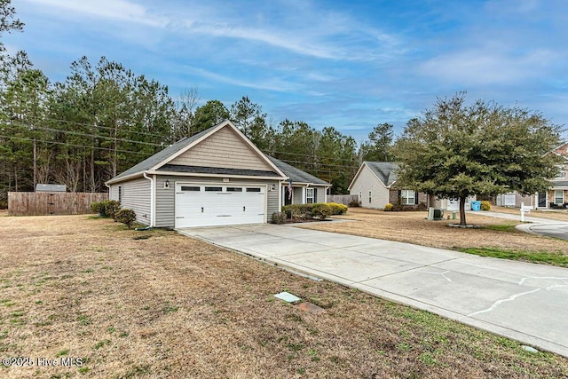 view of front of house with a garage and a front lawn