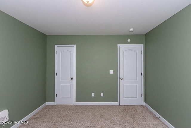 unfurnished bedroom featuring carpet