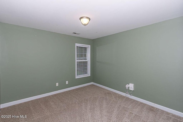 spare room featuring carpet flooring