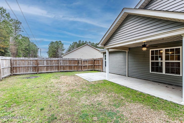 view of yard featuring ceiling fan and a patio area