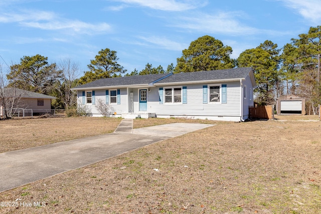 ranch-style home with a front lawn, crawl space, a detached garage, and fence