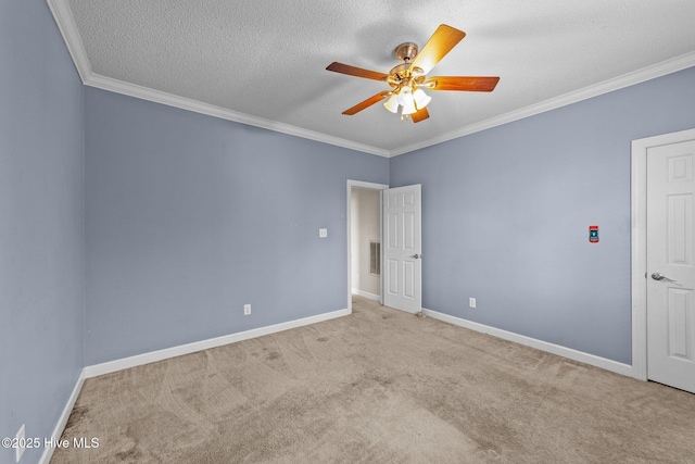 unfurnished room featuring carpet, a ceiling fan, and ornamental molding