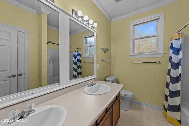 bathroom with ornamental molding, curtained shower, toilet, and a sink