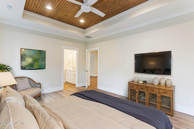 131 NW 18th St, Oak Island, NC 28465 - bedroom with a raised ceiling, wood ceiling, baseboards, light wood finished floors, and ornamental molding