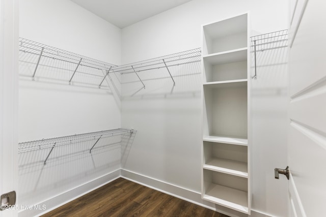 131 NW 18th St, Oak Island, NC 28465 - spacious closet with dark wood finished floors