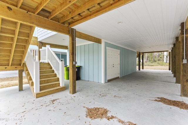 131 NW 18th St, Oak Island, NC 28465 - view of patio with stairs and an attached carport