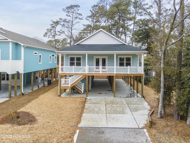 view of front facade featuring a carport, central air condition unit, and covered porch