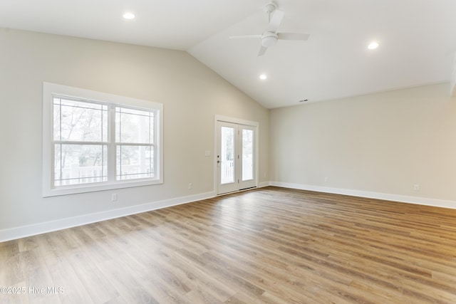 unfurnished room with lofted ceiling, light hardwood / wood-style flooring, french doors, and ceiling fan