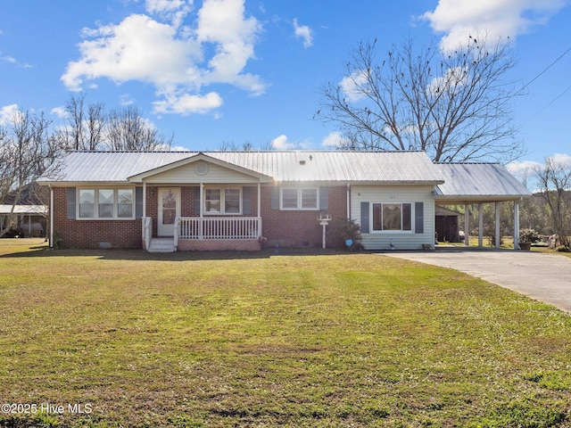 ranch-style home featuring a porch, a carport, and a front yard