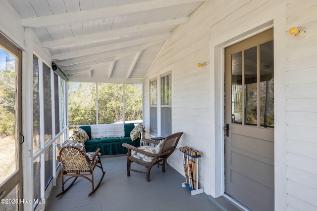 sunroom / solarium with wood ceiling and vaulted ceiling with beams