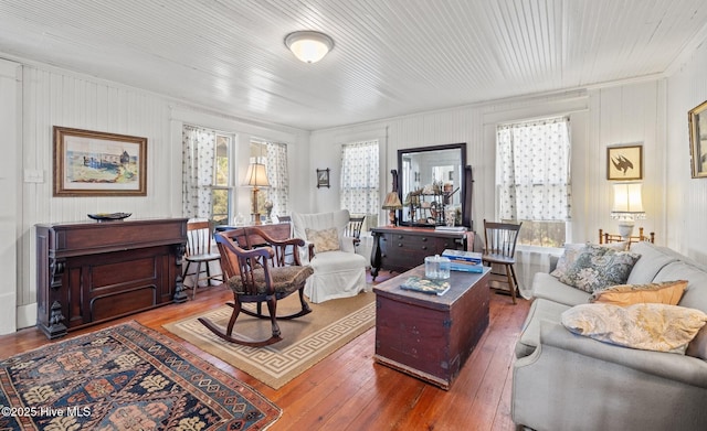 living area with hardwood / wood-style flooring and plenty of natural light