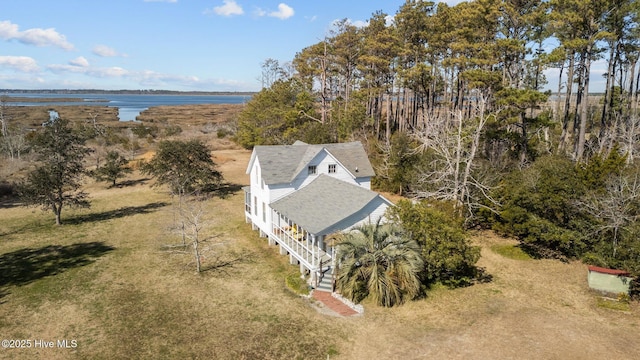 birds eye view of property with a water view