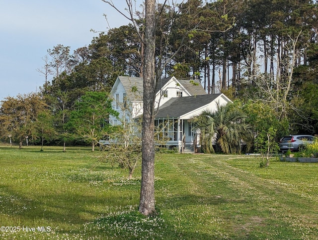 view of front of property with a porch and a front lawn