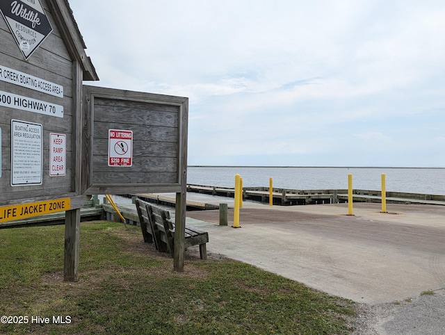 surrounding community with a water view