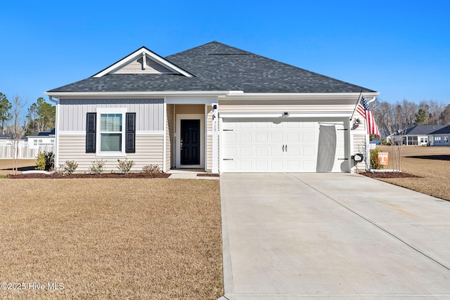 view of front facade featuring a garage and a front lawn