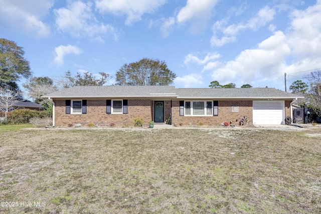 ranch-style house featuring a front lawn, brick siding, and an attached garage