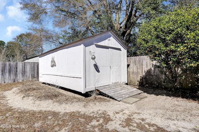 view of shed featuring a fenced backyard