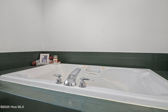 bathroom with tiled tub