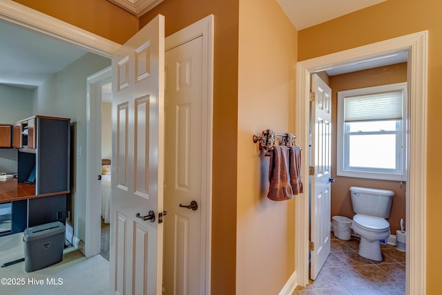 bathroom with tile patterned flooring and toilet