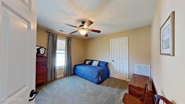 carpeted bedroom with ceiling fan