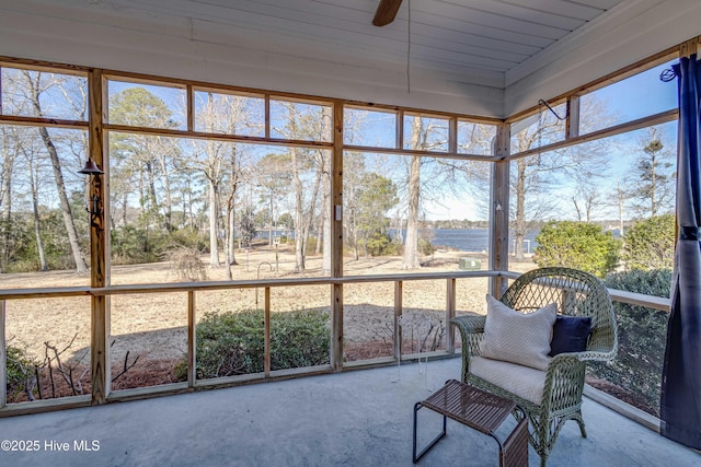 sunroom / solarium featuring ceiling fan