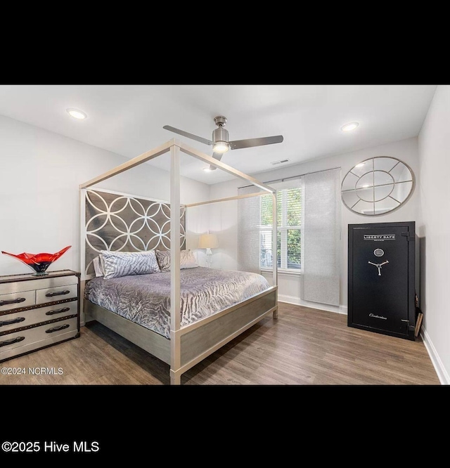 bedroom with hardwood / wood-style floors and ceiling fan