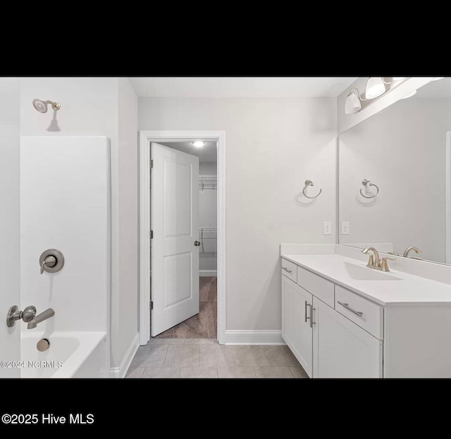 bathroom featuring vanity and shower / bathing tub combination