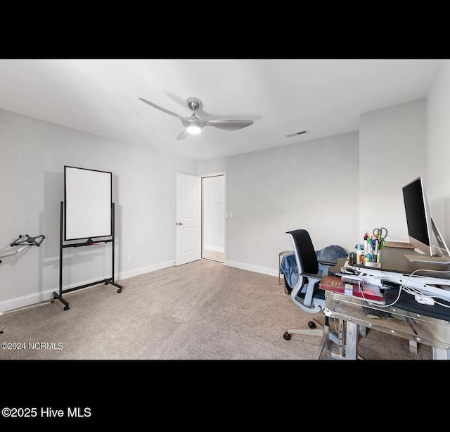 office space with carpet floors and ceiling fan