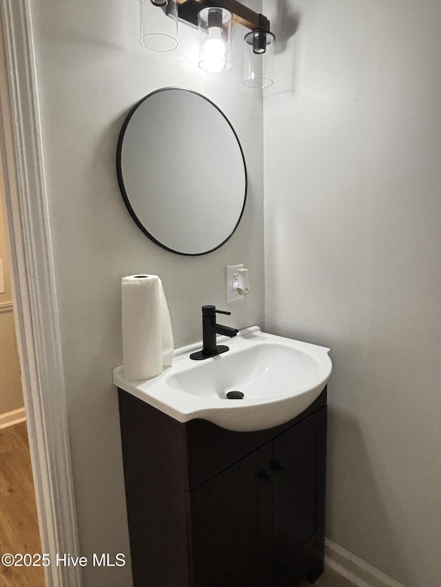 bathroom with vanity and hardwood / wood-style floors