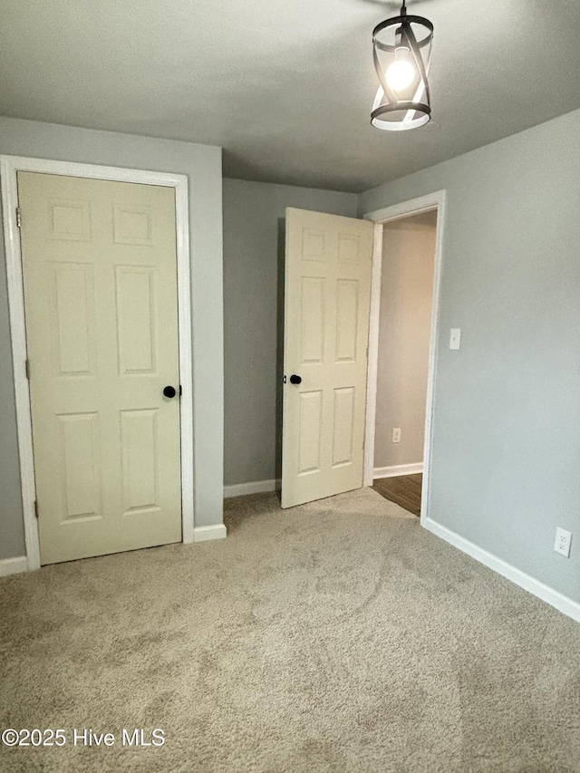 unfurnished bedroom with carpet flooring