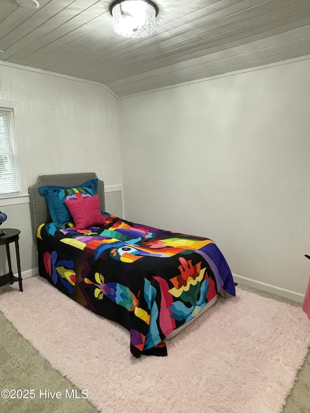 carpeted bedroom featuring wood ceiling