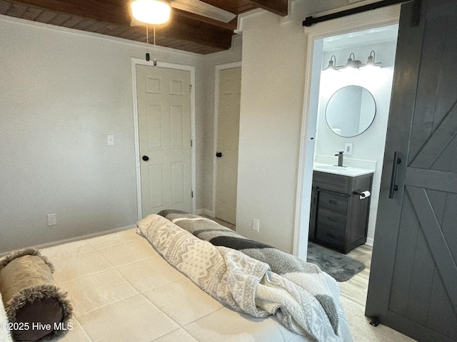 bedroom with sink and connected bathroom