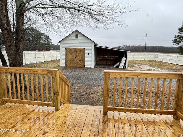 wooden deck featuring a storage shed