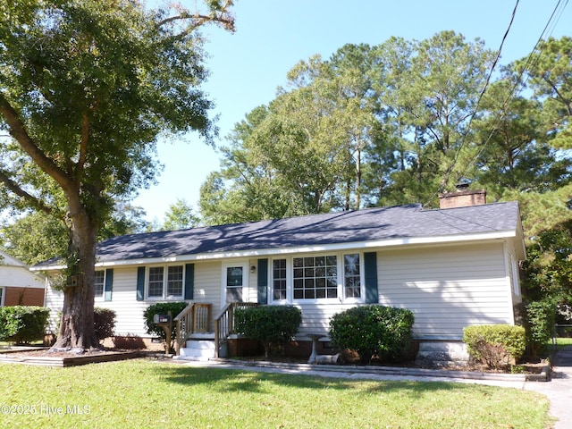 single story home with a front yard