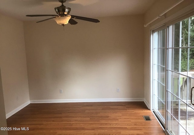 empty room with ceiling fan and light wood-type flooring