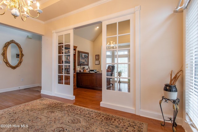 interior space with an inviting chandelier, hardwood / wood-style floors, and french doors