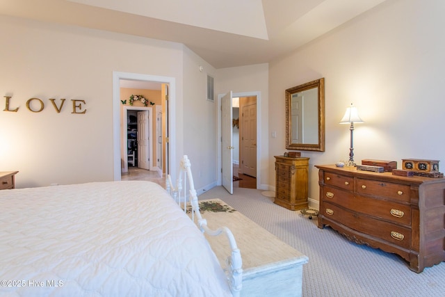 bedroom featuring light colored carpet