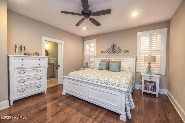 bedroom featuring baseboards, dark wood finished floors, ceiling fan, ensuite bath, and recessed lighting