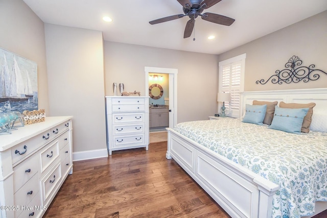 bedroom featuring baseboards, ceiling fan, dark wood-style flooring, ensuite bathroom, and recessed lighting